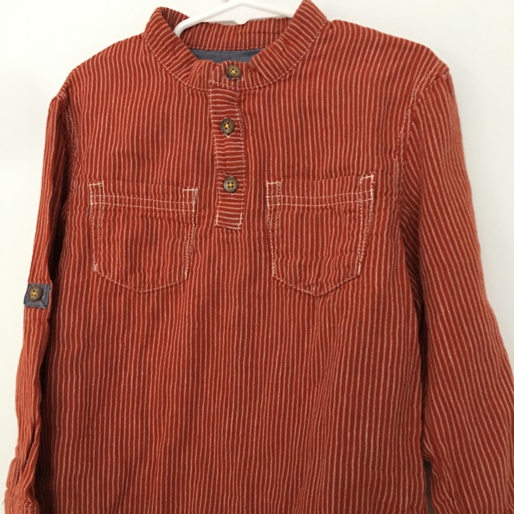 Orange shirt with white stripes